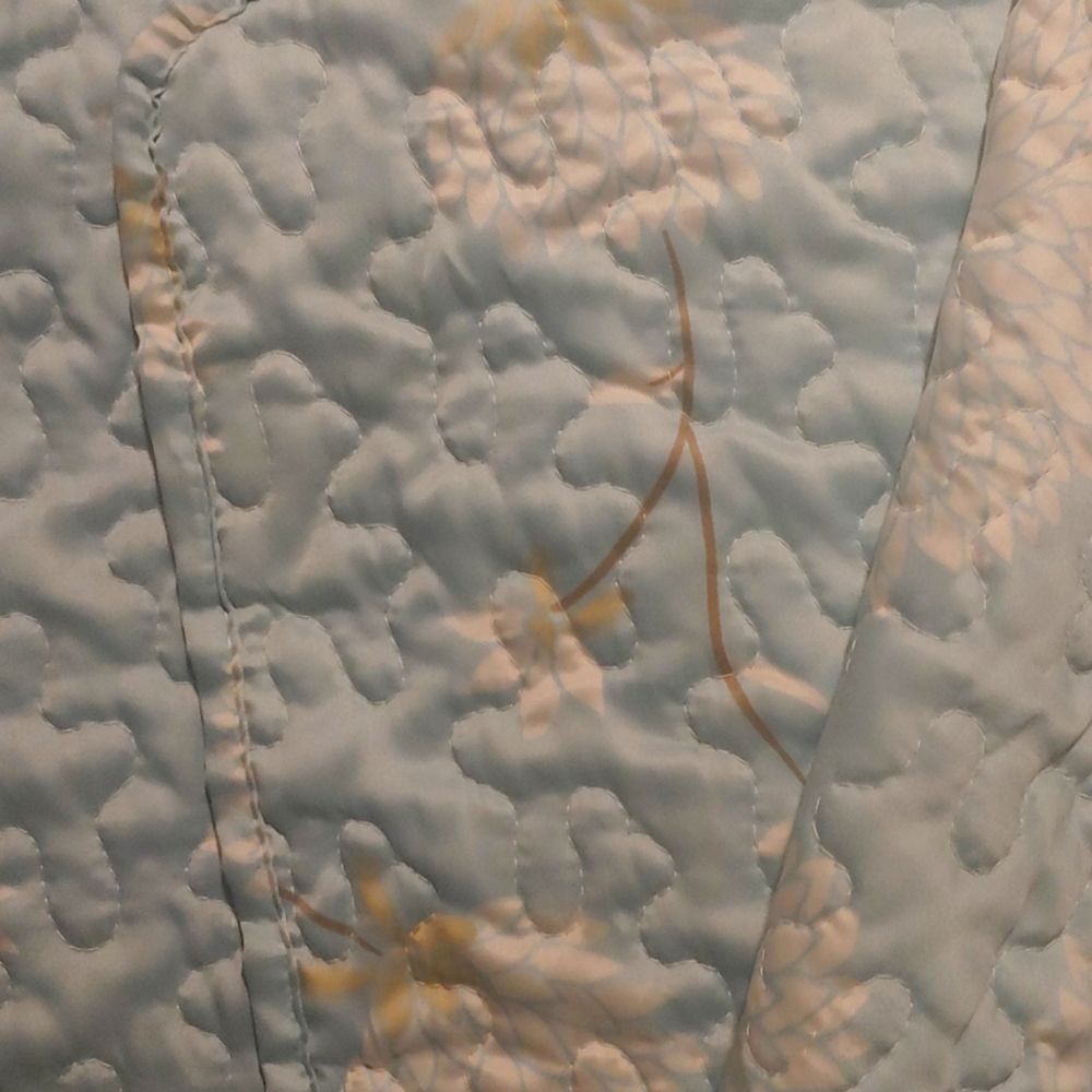 Quilted coverlet and matching envelope pillowcases